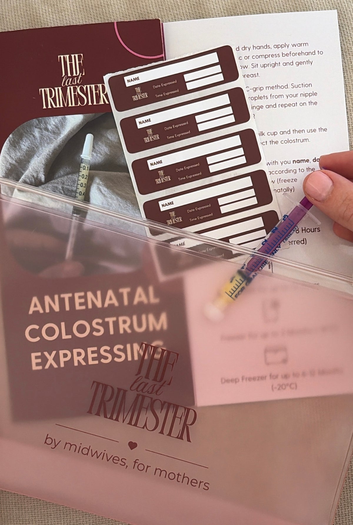 Colostrum Expressing Kit: syringe of expressed colostrum, syringe labels and the how-to guide in the TLT freezer pouch